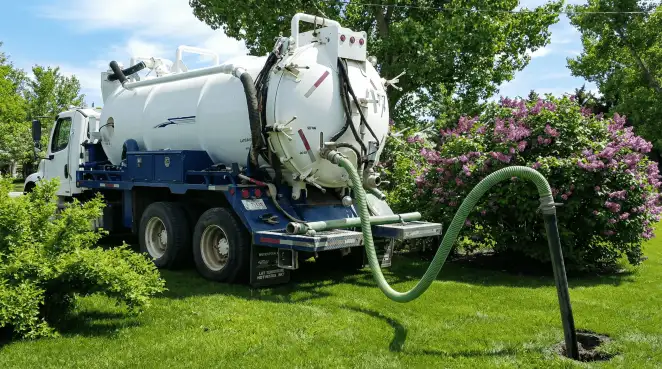 Professional vacuum truck performing residential drainage and septic maintenance in Pittsburgh, PA